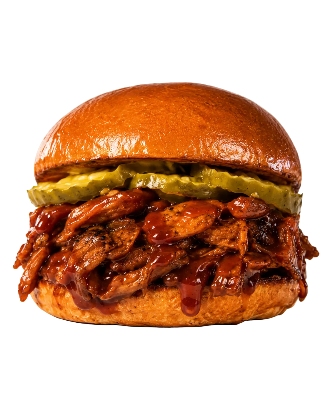 BBQ Brisket sandwich on a bun topped with pickles and BBQ sauce 