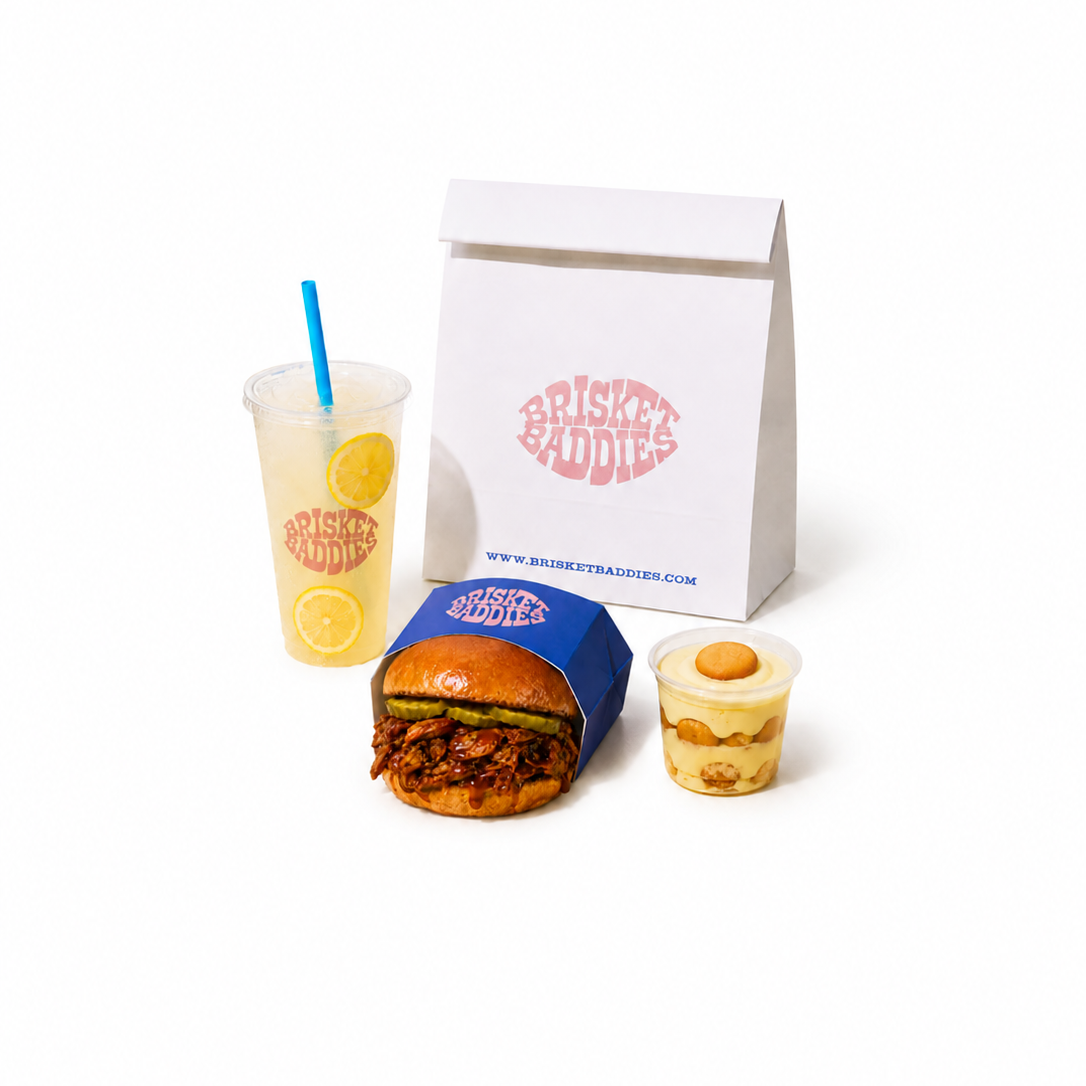 Fast food meal with burger, drink, and dessert on a white background